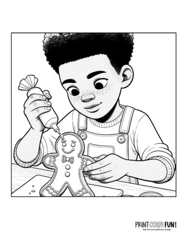 A boy carefully icing a gingerbread man cookie from PrintColorFun com