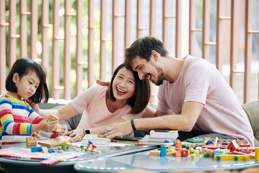 Family playing together with blocks and toys