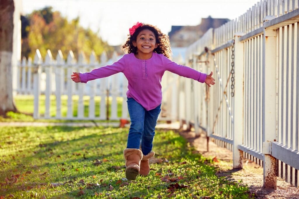 Little girl running outside