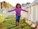 Little girl running outside